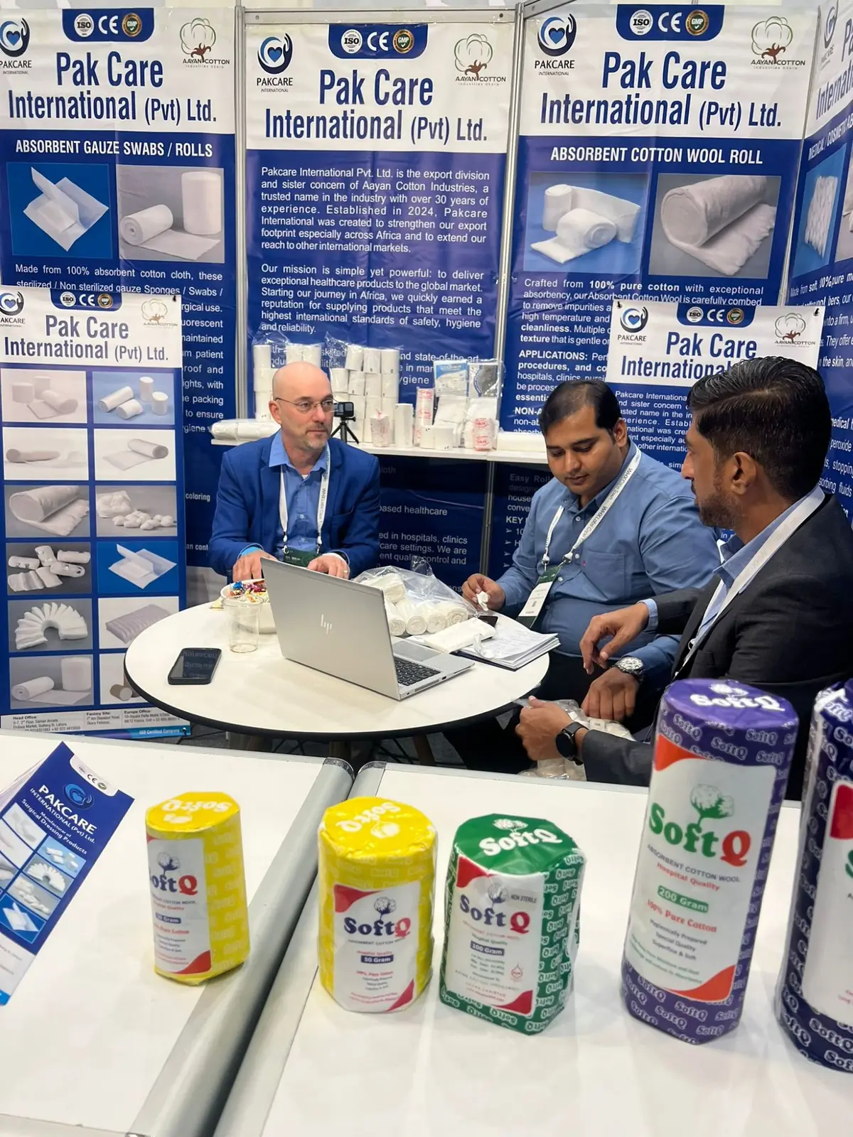 Discussing samples with a buyer, SoftQ cotton wool rolls in front