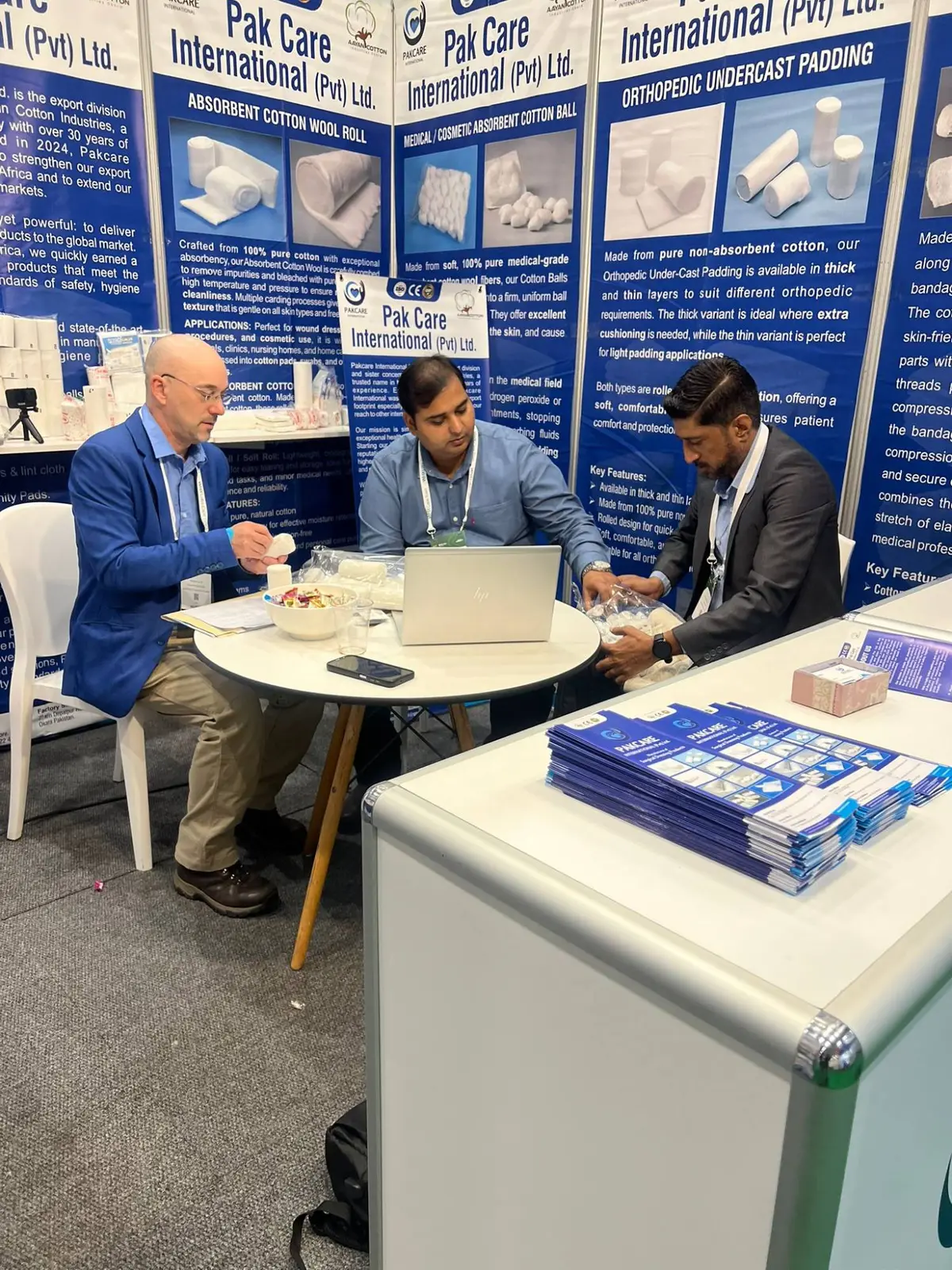 Examining cotton samples with a buyer