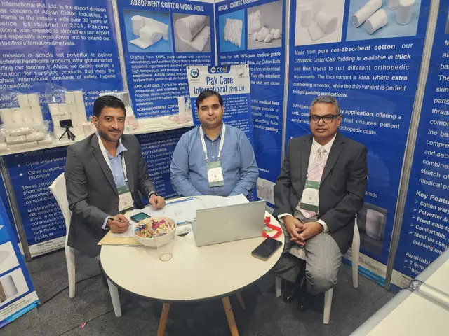 The Pak Care team seated together at the stand