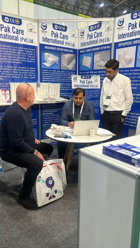 The Pak Care team presenting to a visitor at the stand