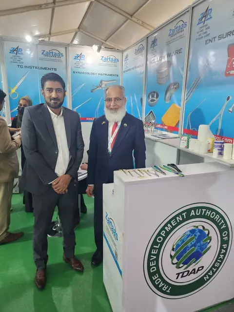 With a guest beside the TDAP counter at the stand in Nairobi