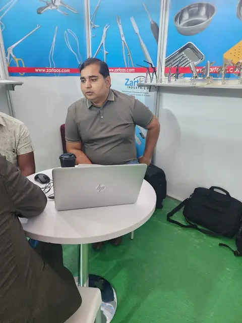 A Pak Care team member at the stand table in Nairobi